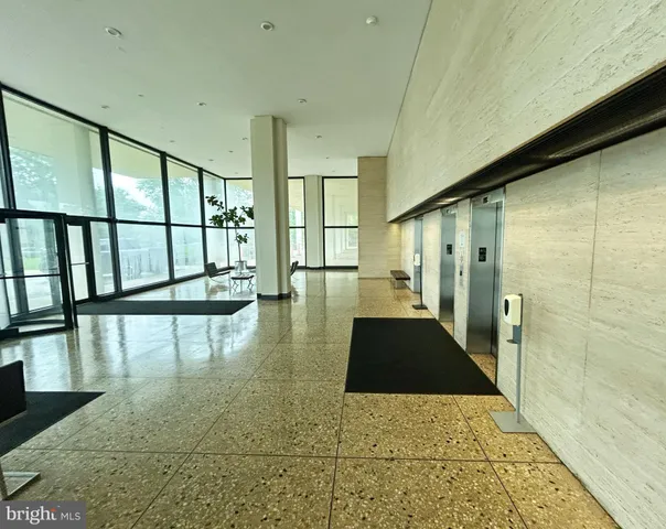 a living room with a large window and a table