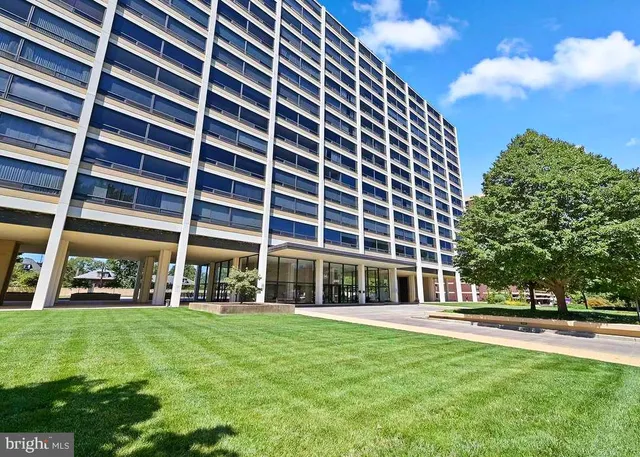 a front view of building with yard