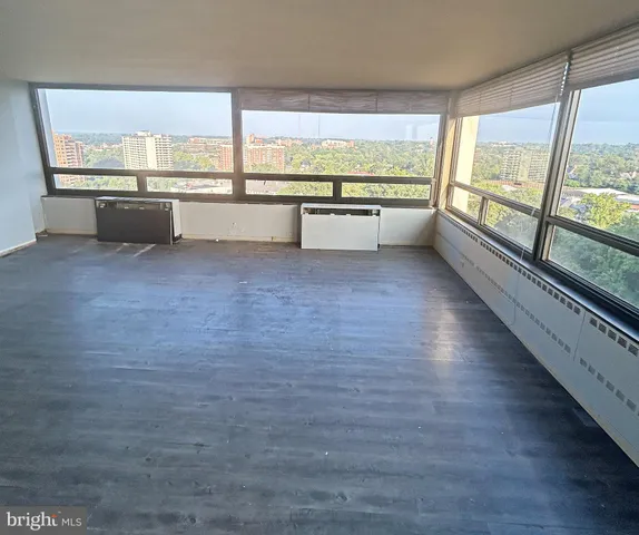 a view of cabinets with wooden floor