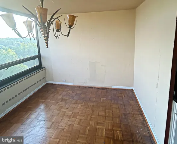 a kitchen with granite countertop a stove a sink and a refrigerator