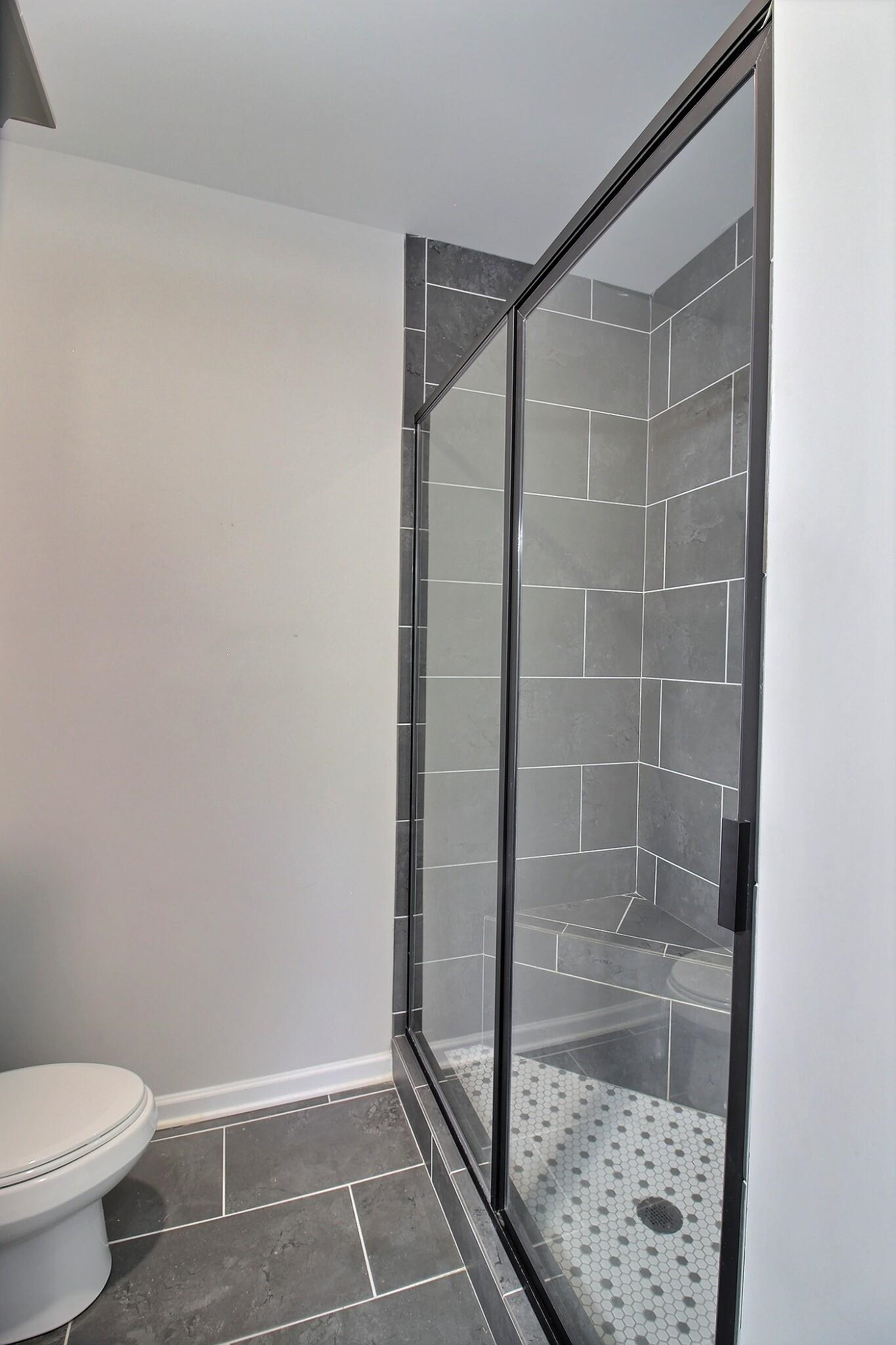 3290 Raleigh Lagrange Drive Rossville, TN 38066 - Photo 18 of 25 a bathroom with a shower and a toilet