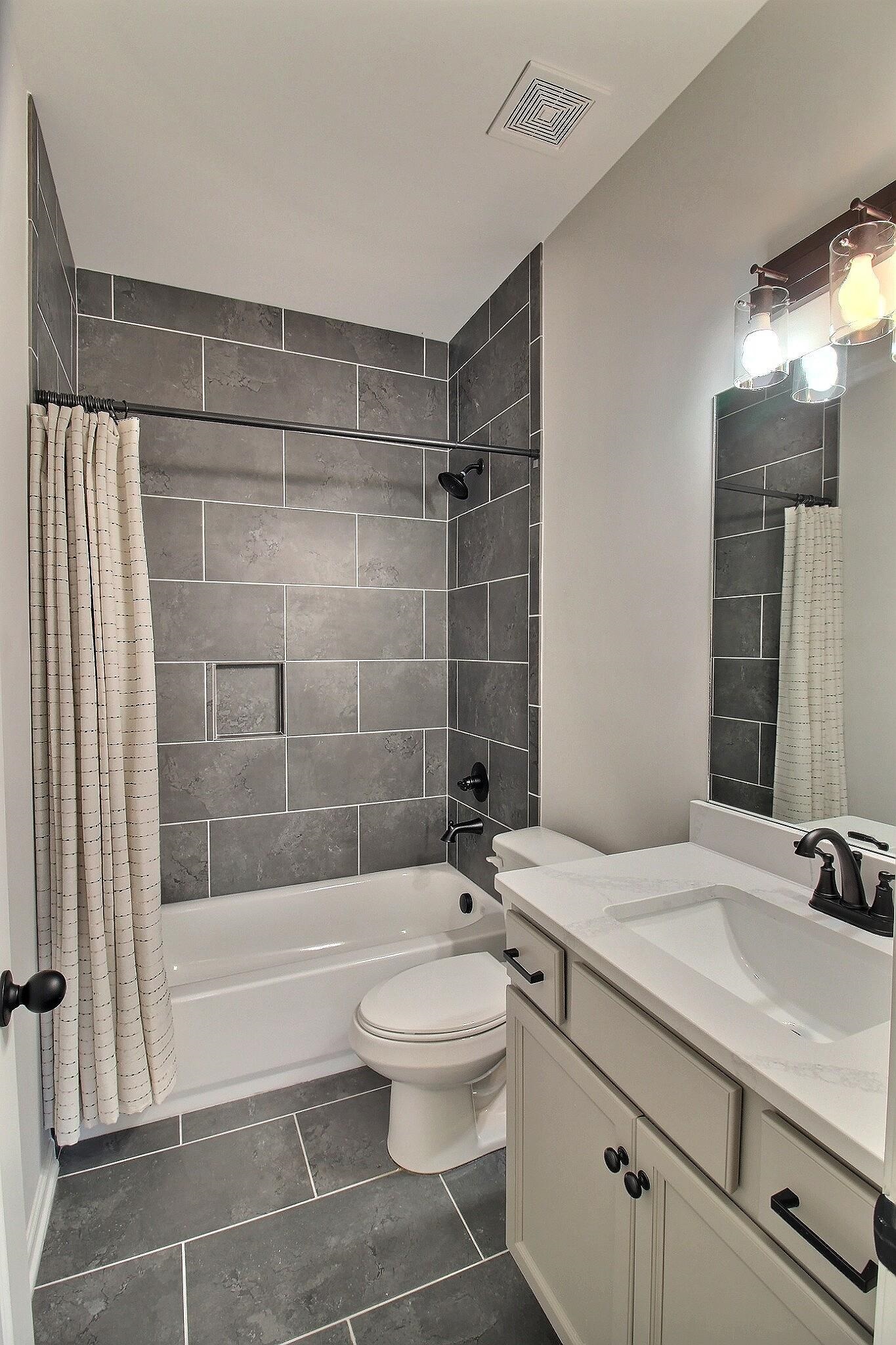 3290 Raleigh Lagrange Drive Rossville, TN 38066 - Photo 20 of 25 a bathroom with a sink a toilet and shower