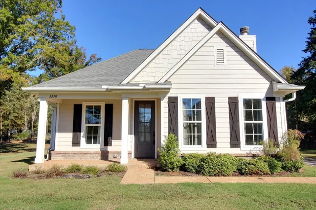 front view of a house with a yard