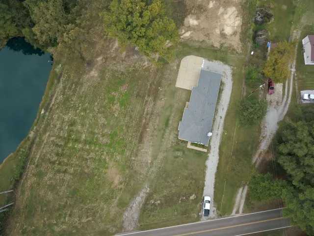 a view of a tiny house with yard