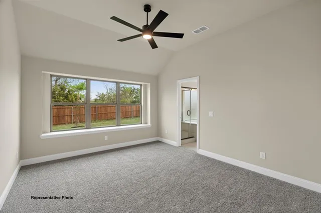 a view of a livingroom with a ceiling fan and window