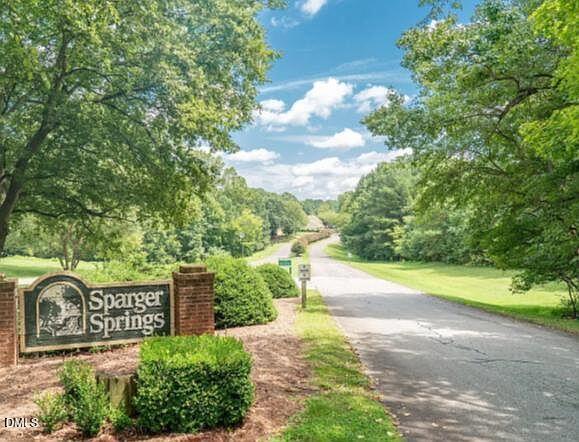 20 Sparger Springs Lane Durham, NC 27705 - Photo 1 of 11 a view of a street with an trees