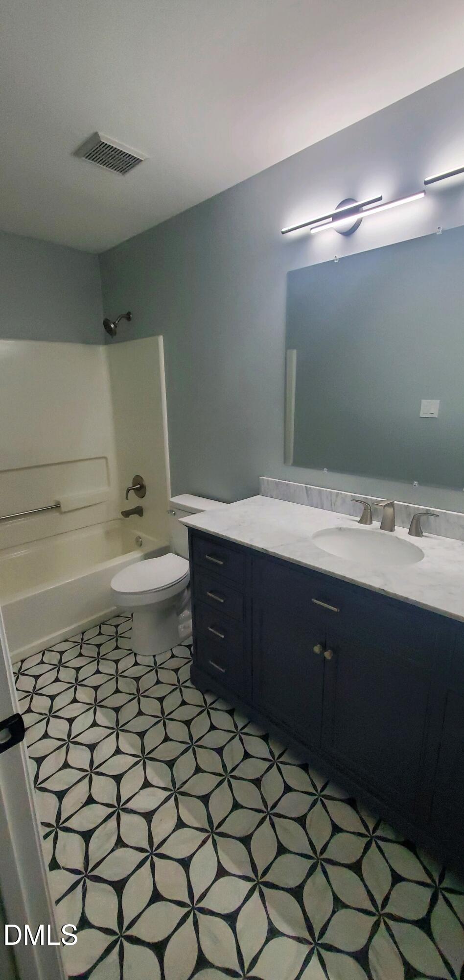 20 Sparger Springs Lane Durham, NC 27705 - Photo 4 of 11 a bathroom with a sink toilet and mirror