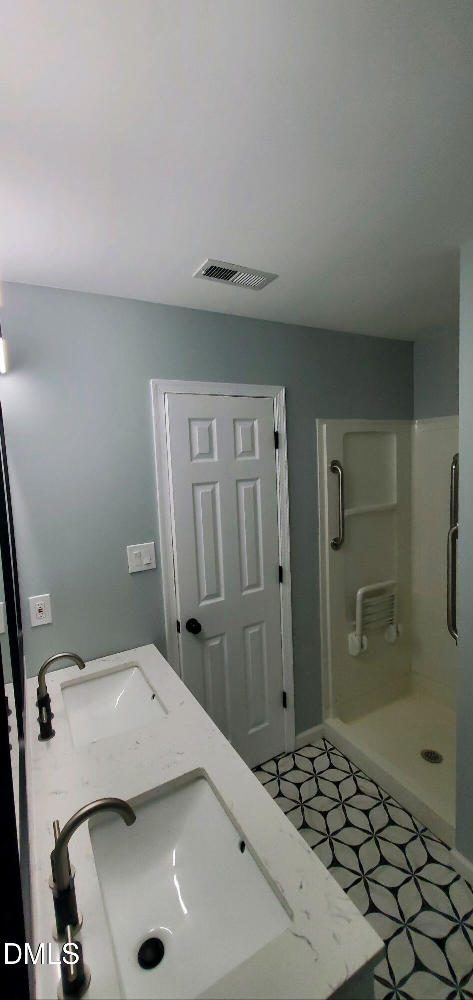 20 Sparger Springs Lane Durham, NC 27705 - Photo 10 of 11 a bathroom with a sink and a shower