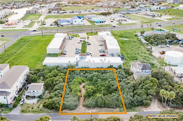 an aerial view of residential building and lake