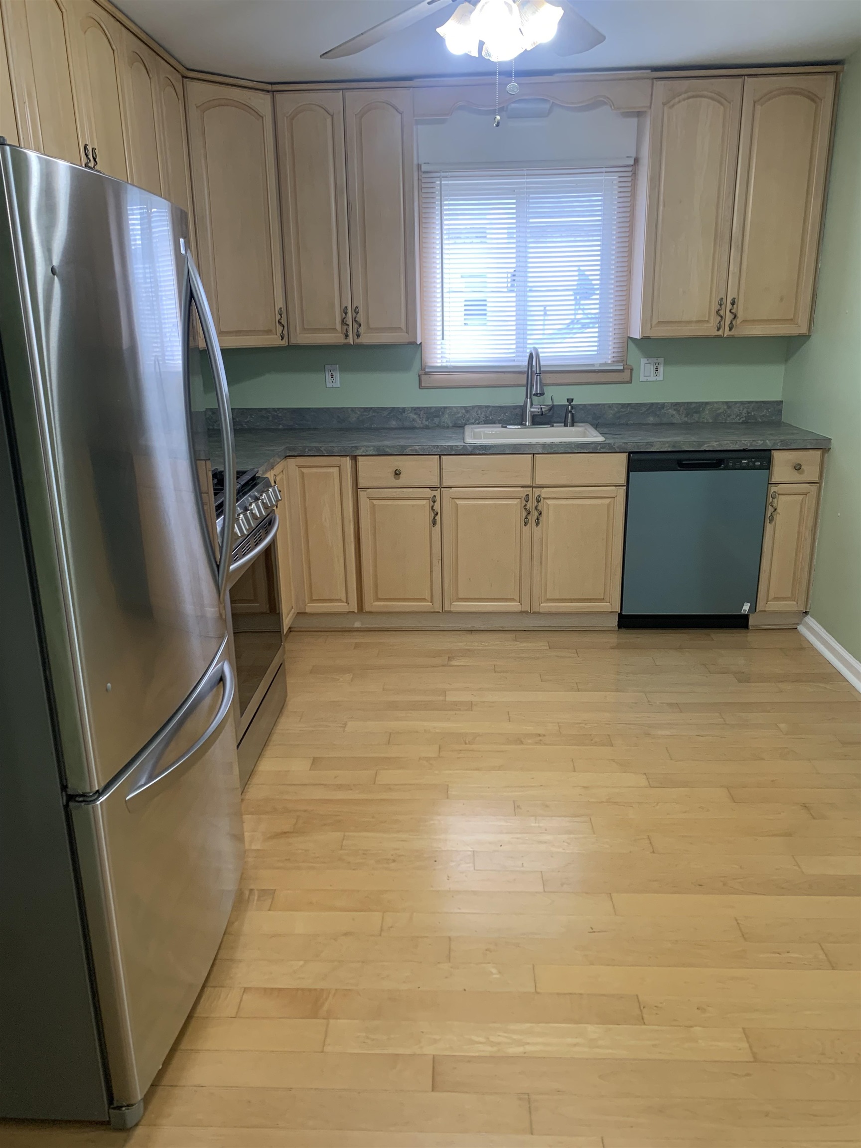 836 Eighth Street Secaucus, NJ 07094 - Photo 3 of 9 a kitchen with granite countertop a refrigerator sink and cabinets