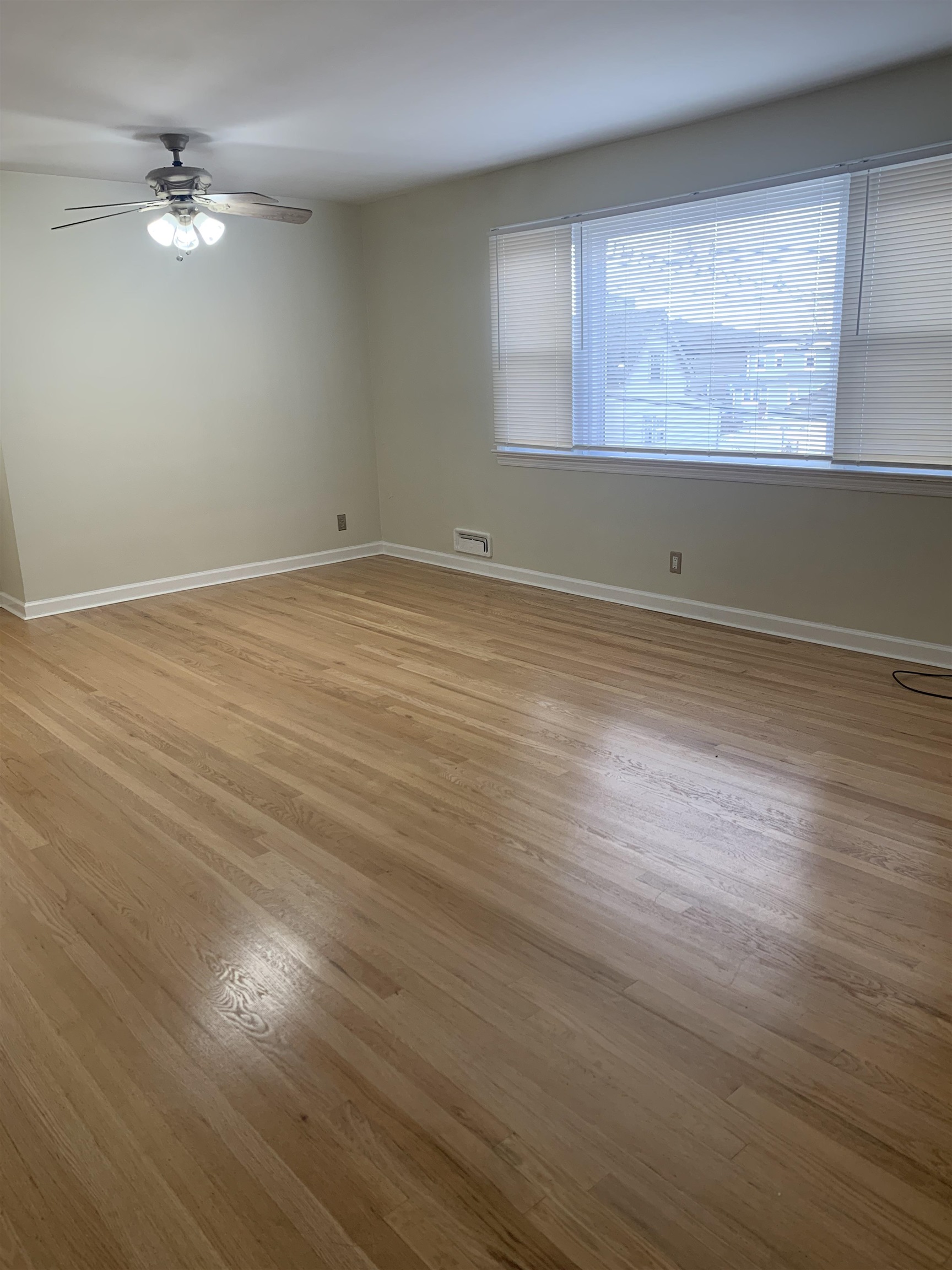 836 Eighth Street Secaucus, NJ 07094 - Photo 4 of 9 an empty room with wooden floor and windows