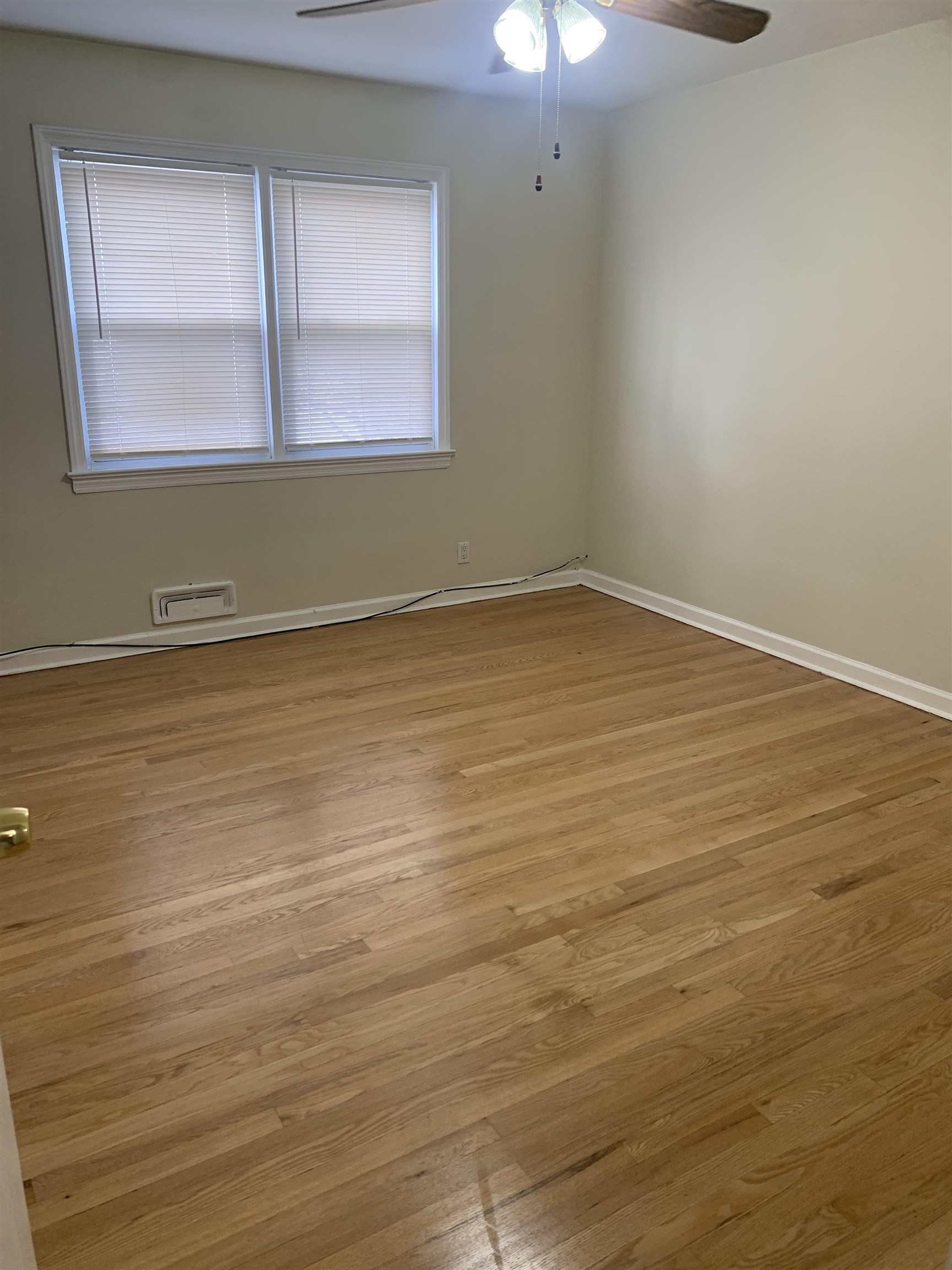 836 Eighth Street Secaucus, NJ 07094 - Photo 7 of 9 an empty room with wooden floor and windows