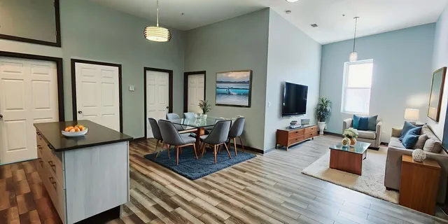 a living room with furniture and a flat screen tv