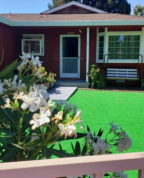 1659 Center Road Novato, CA 94947 - Photo 2 of 17 a front view of a house with a garden