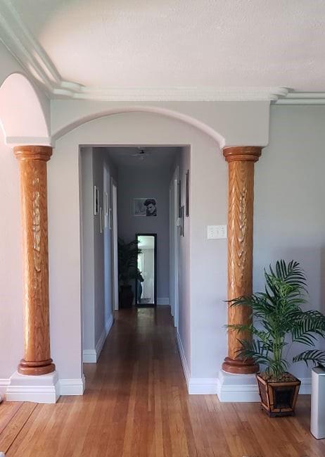 1659 Center Road Novato, CA 94947 - Photo 7 of 17 a view of a hallway with wooden floor and a potted plant