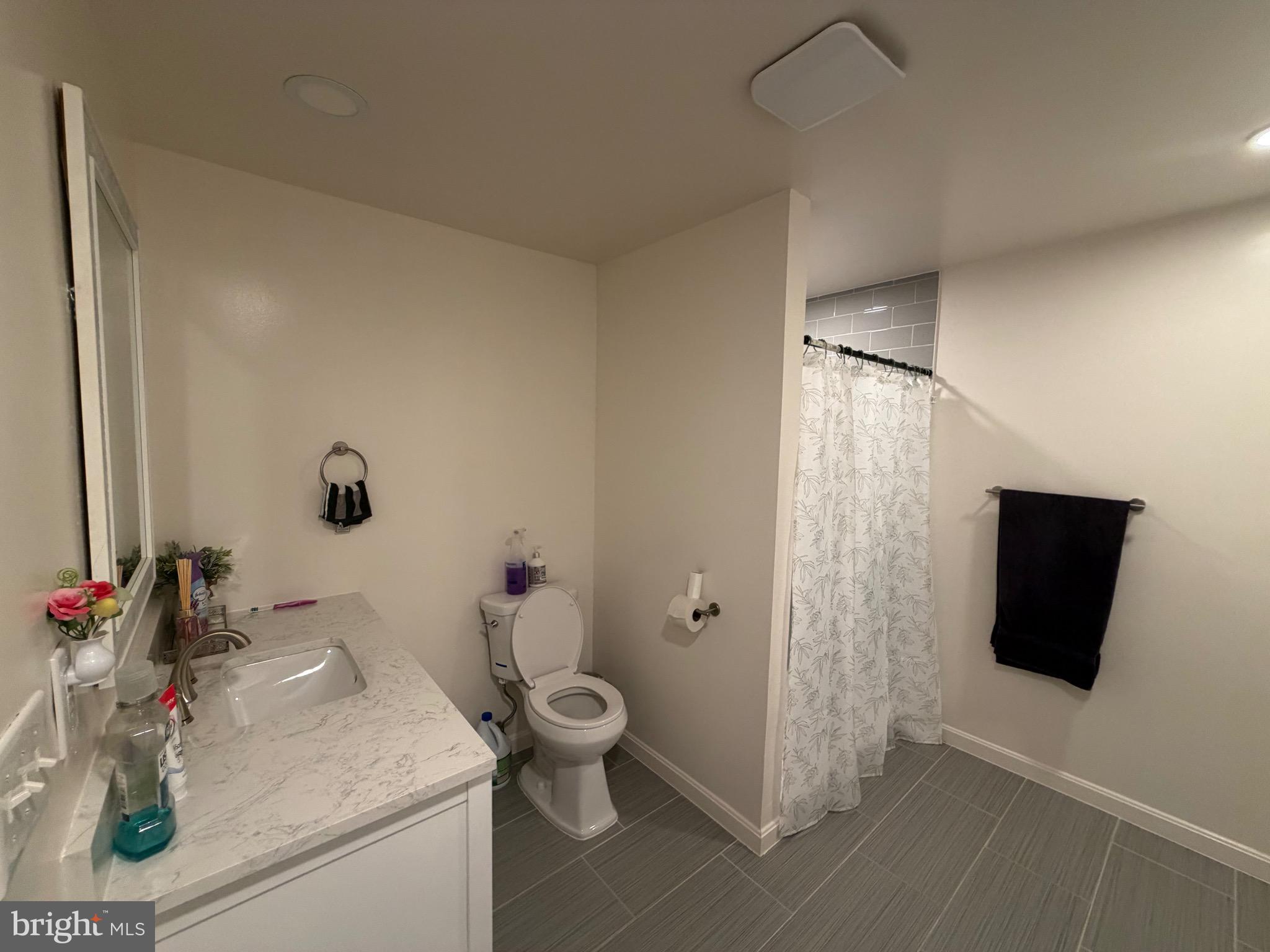 9250 Slidell La Plata, MD 20646 - Photo 23 of 43 a bathroom with a sink toilet and shower