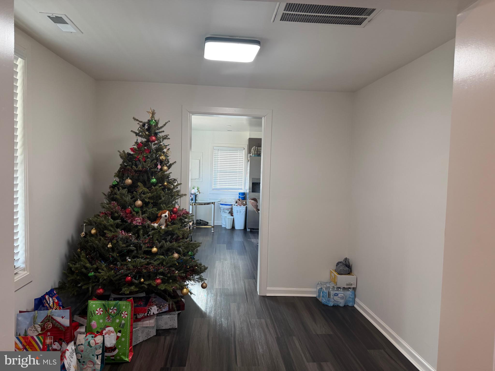 9250 Slidell La Plata, MD 20646 - Photo 25 of 43 a room with wooden floor and a potted plant