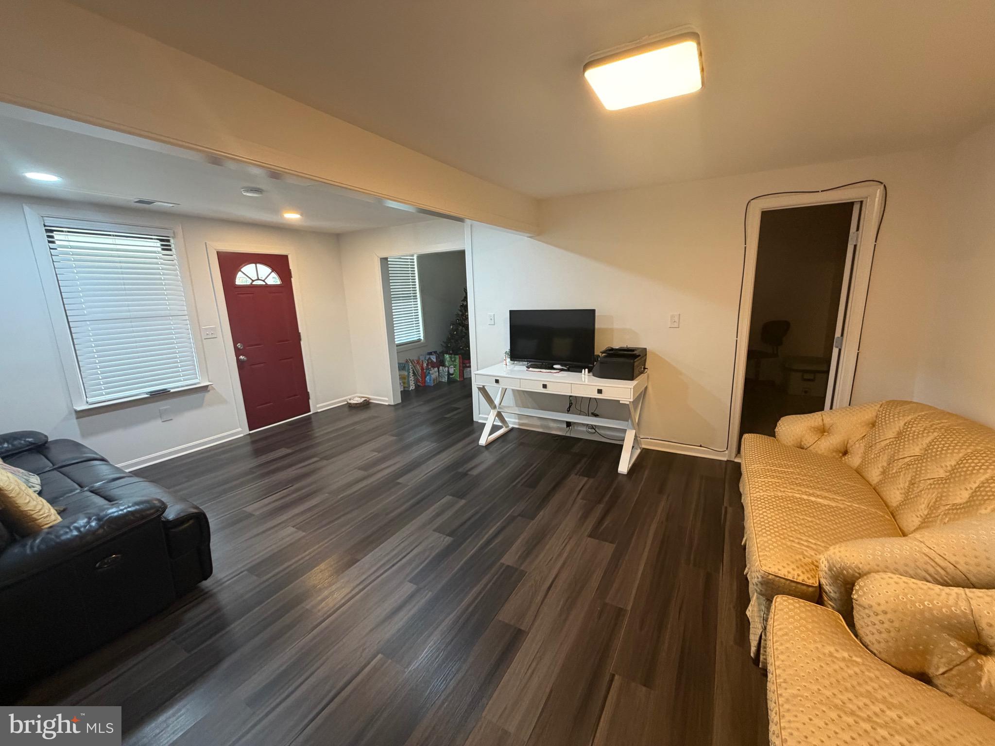 9250 Slidell La Plata, MD 20646 - Photo 28 of 43 a living room with furniture and a flat screen tv