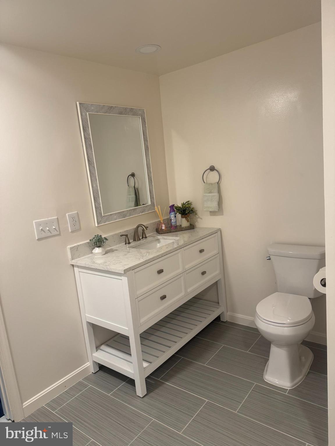 9250 Slidell La Plata, MD 20646 - Photo 3 of 43 a bathroom with a sink toilet and mirror