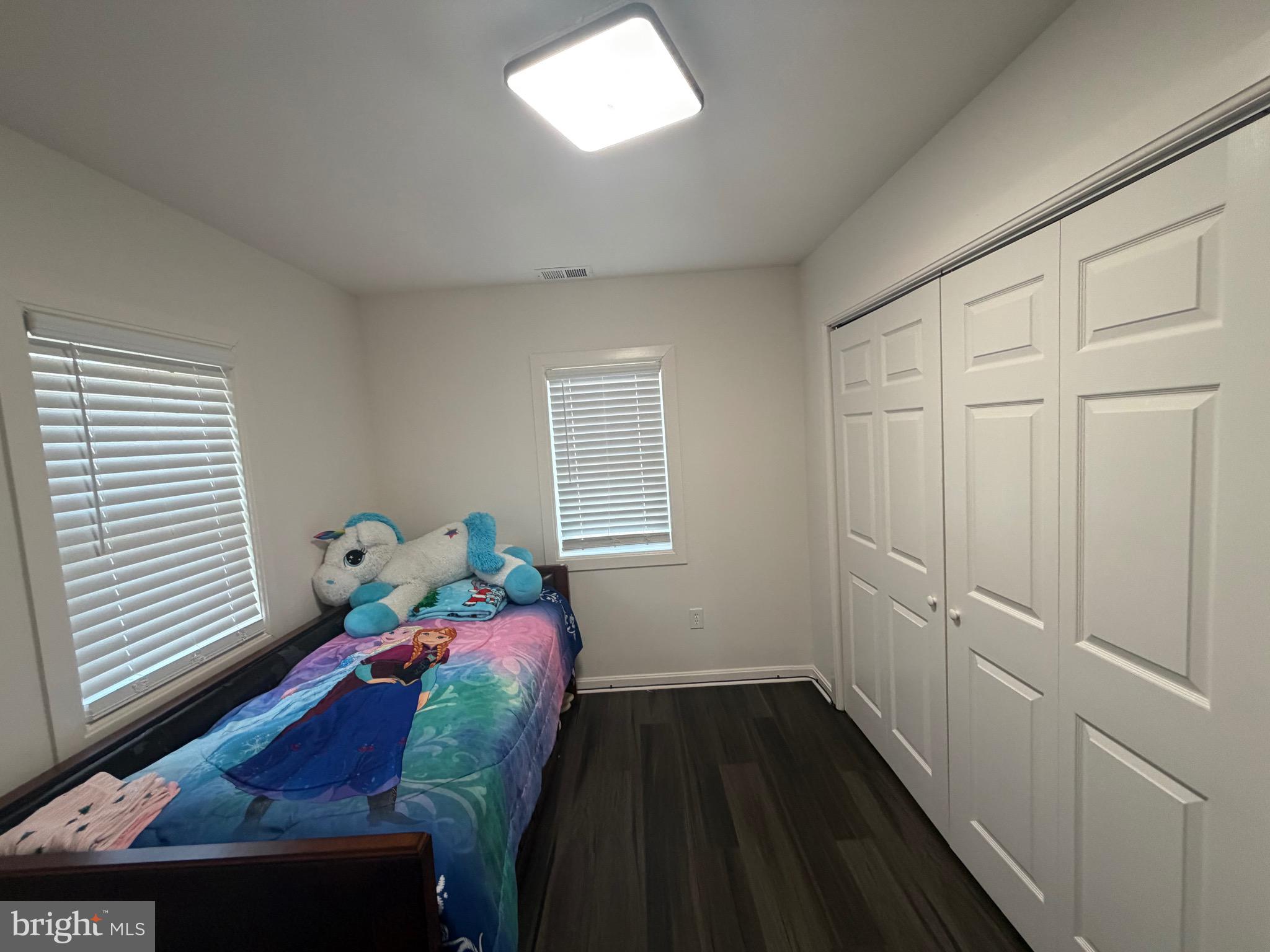 9250 Slidell La Plata, MD 20646 - Photo 32 of 43 a bedroom with a bed and wooden floor