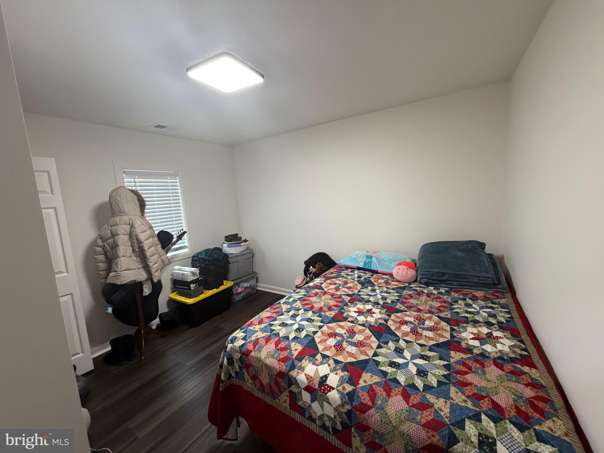 9250 Slidell La Plata, MD 20646 - Photo 39 of 43 a bed room with a bed and a chandelier