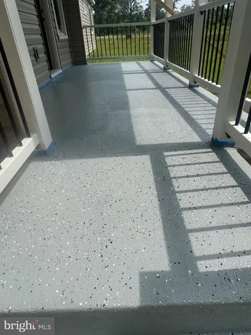 a view of balcony with wooden floor