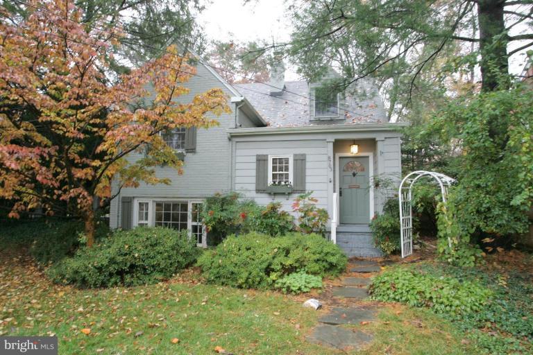 8703 Ridge Road Bethesda, MD 20817 - Photo 1 of 8 front view of a house with a garden