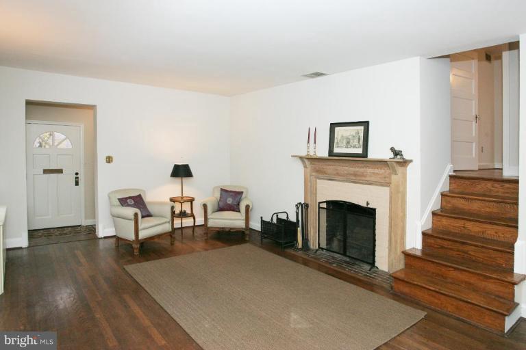 8703 Ridge Road Bethesda, MD 20817 - Photo 2 of 8 a living room with furniture and a fireplace