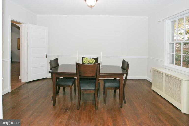 8703 Ridge Road Bethesda, MD 20817 - Photo 3 of 8 a view of a dining room with furniture and wooden floor