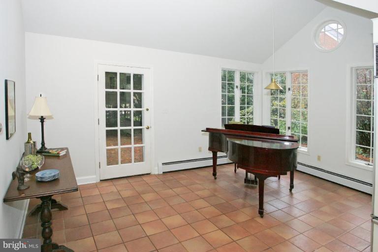 8703 Ridge Road Bethesda, MD 20817 - Photo 5 of 8 a room with pool table and windows