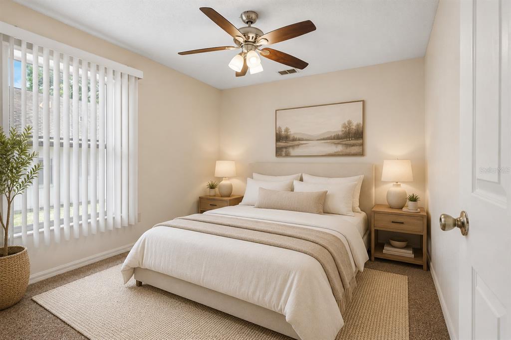 2596 Alclobe Circle Ocoee, FL 34761 - Photo 50 of 70 a bedroom with a bed and a window