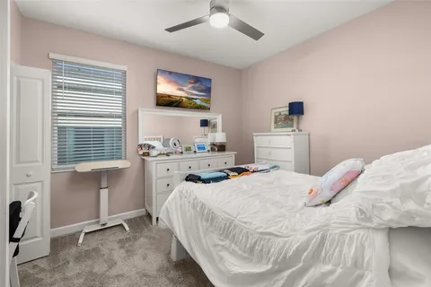 a work room with furniture and a flat screen tv