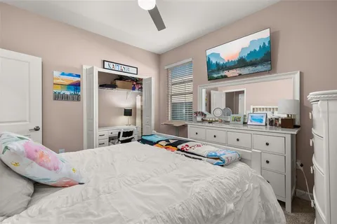 a work room with furniture and a flat screen tv