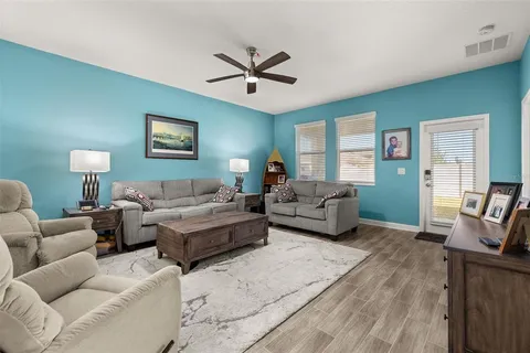 a kitchen with a sink a stove top oven and refrigerator