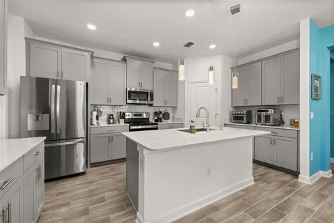 a bathroom with a tub a sink and mirror