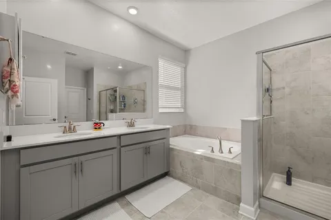 an aerial view of a house with swimming pool and outdoor seating