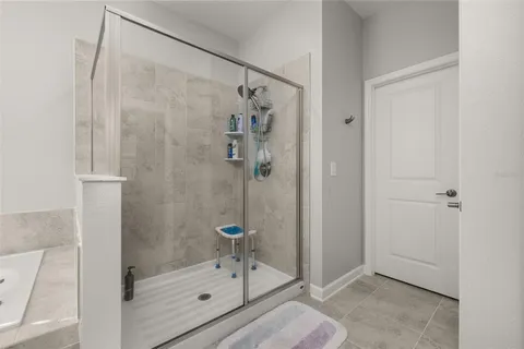 an aerial view of a house with a swimming pool patio and outdoor seating