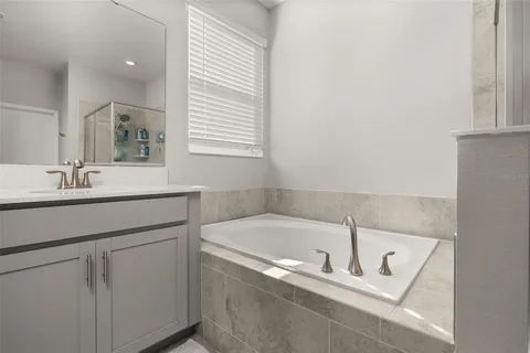 a aerial view of a house with swimming pool and ocean view