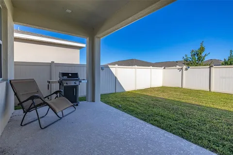 an aerial view of residential building and lake