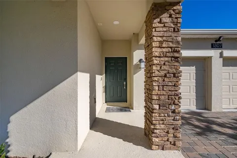 a view of an entryway with wooden floor