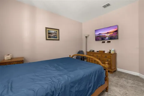 a white toilet sitting next to a bath tub