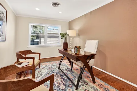 a workspace with furniture and window