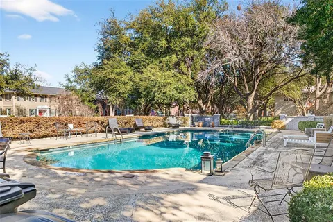 a view of a backyard with sitting area