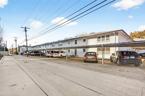 a view of a cars parked in front of a building