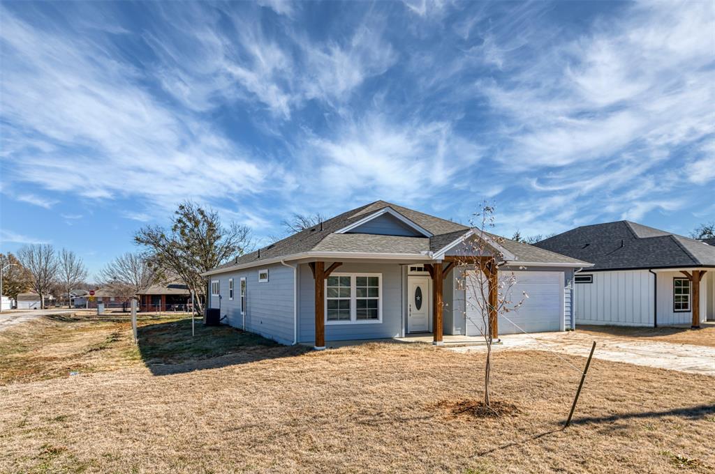 200 South Oak Street Venus, TX 76084 - Photo 2 of 36 a front view of a house with a yard
