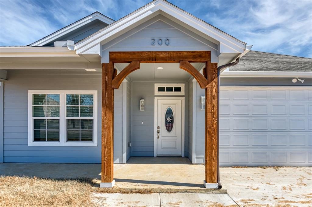 200 South Oak Street Venus, TX 76084 - Photo 6 of 36 a front view of a house with a yard