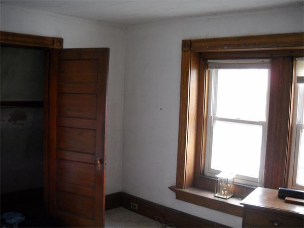 15 County Road Everett, MA 02149 - Photo 5 of 19 a room with a window and dresser