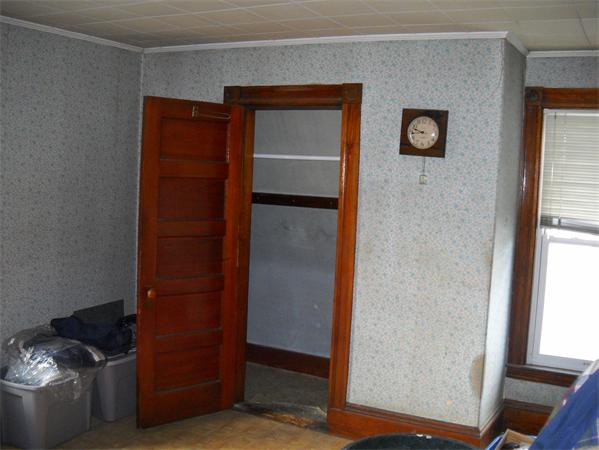 15 County Road Everett, MA 02149 - Photo 6 of 19 a room with closet and wooden floor