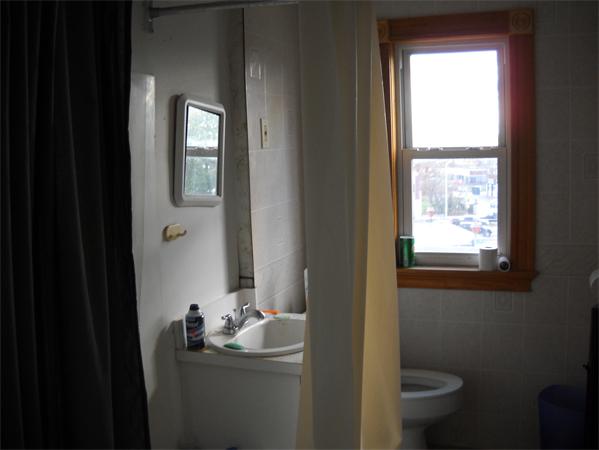 15 County Road Everett, MA 02149 - Photo 9 of 19 a bathroom with a sink toilet and window