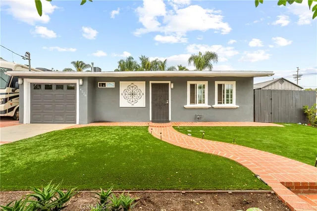 a view of a backyard with a garden and plants